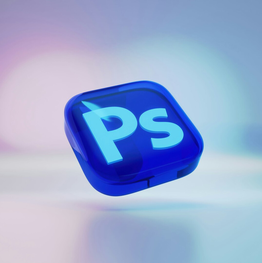 Video editor working at a multi-screen editing workstation